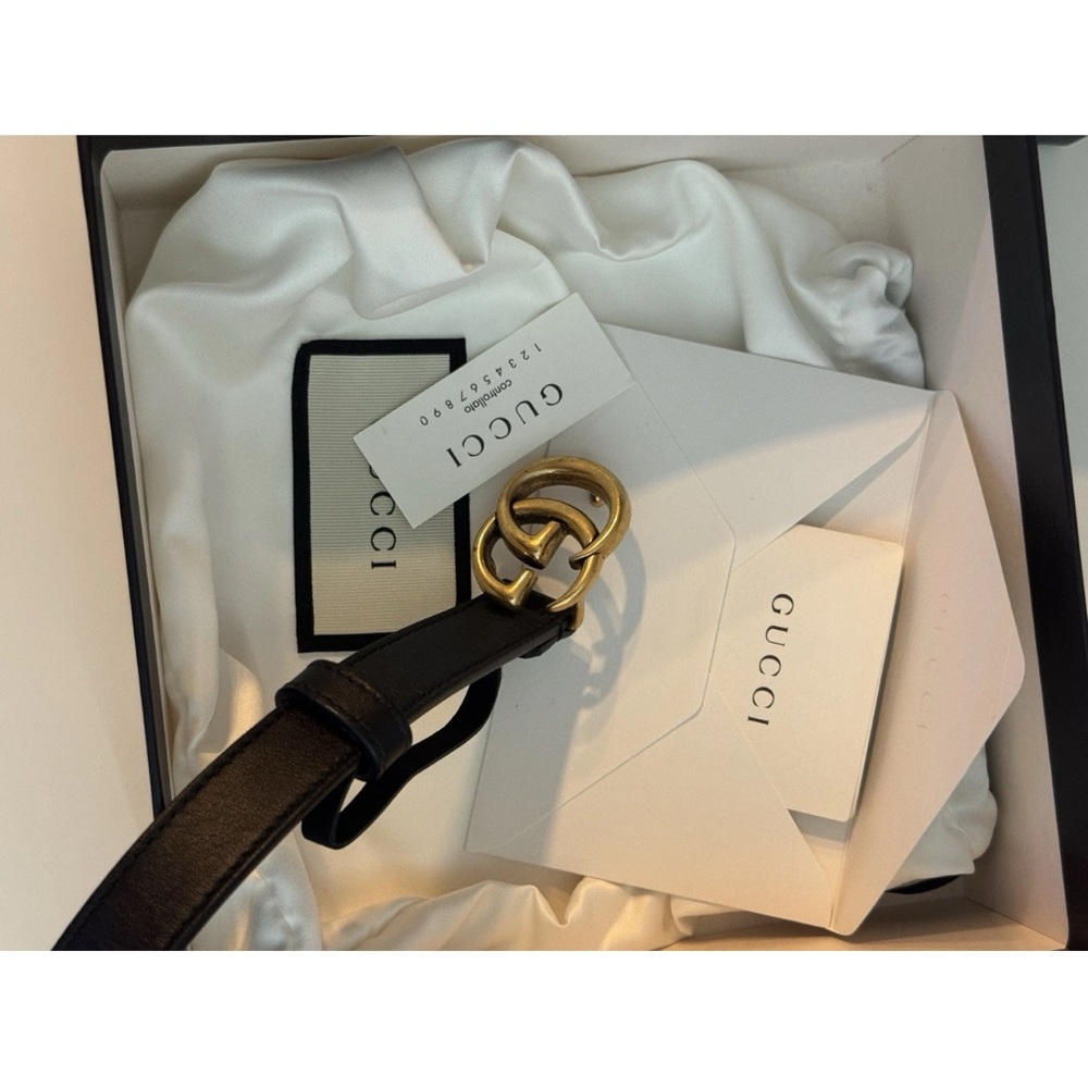 Gucci women’s black belt size 70 with Gold Interlocking G Buckle